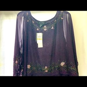 A plum full length cape sleeve gown. Never worn.